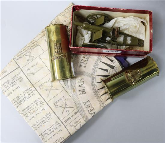 A Britains box artillery gun, two shells and a Military scarf